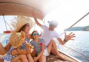 A family having fun on a boat in the sunlight.