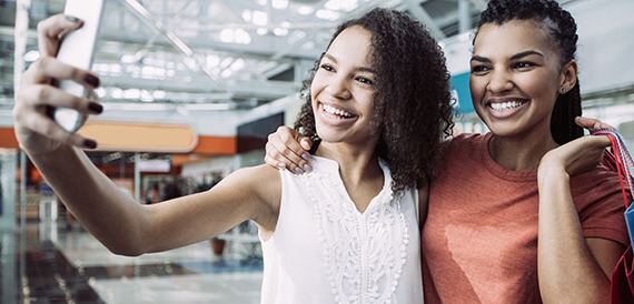 Two women taking a selfie.