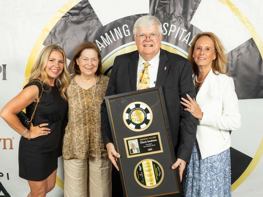 Chevis Swetman and loved ones show off his 2023 Mississippi Gaming Hall of Fame award