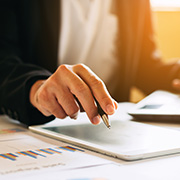A woman going over her finances at a desk.