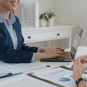 A woman meeting with a banker over finances.