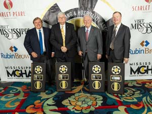 Chevis Swetman and the rest of the 2023 Mississippi Gaming Hall of Fame inductees stand next to their awards