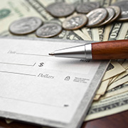 A person receiving a check from a banker.